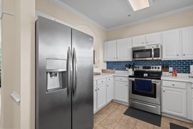 Welcome to this charming 2 bedroom, 2 bathroom top-floor condo on Barefoot Resort and Golf Club  in South Carolina - for sale on GolfHomes.com, golf home, golf lot