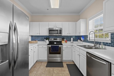 Welcome to this charming 2 bedroom, 2 bathroom top-floor condo on Barefoot Resort and Golf Club  in South Carolina - for sale on GolfHomes.com, golf home, golf lot
