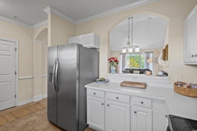 Welcome to this charming 2 bedroom, 2 bathroom top-floor condo on Barefoot Resort and Golf Club  in South Carolina - for sale on GolfHomes.com, golf home, golf lot