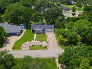 Discover this immaculate, move-in-ready home in the established on De Cordova Bend Country Club in Texas - for sale on GolfHomes.com, golf home, golf lot