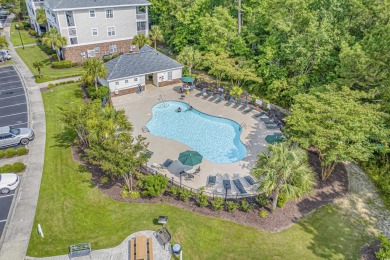 Welcome to this charming 2 bedroom, 2 bathroom top-floor condo on Barefoot Resort and Golf Club  in South Carolina - for sale on GolfHomes.com, golf home, golf lot