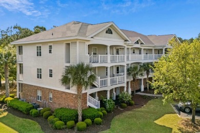 Welcome to this charming 2 bedroom, 2 bathroom top-floor condo on Barefoot Resort and Golf Club  in South Carolina - for sale on GolfHomes.com, golf home, golf lot