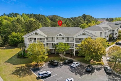 Welcome to this charming 2 bedroom, 2 bathroom top-floor condo on Barefoot Resort and Golf Club  in South Carolina - for sale on GolfHomes.com, golf home, golf lot