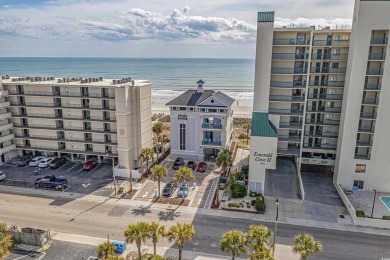 Welcome to this charming 2 bedroom, 2 bathroom top-floor condo on Barefoot Resort and Golf Club  in South Carolina - for sale on GolfHomes.com, golf home, golf lot