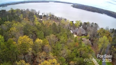 This Badin Lake waterfront lot is located in the prestigious on Old North State Club at Uwharrie Point Golf community in North Carolina - for sale on GolfHomes.com, golf home, golf lot