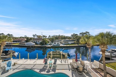 Tucked behind the private gates of the Bay Point community, this on Bay Point Resort Golf Club in Florida - for sale on GolfHomes.com, golf home, golf lot