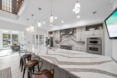 Tucked behind the private gates of the Bay Point community, this on Bay Point Resort Golf Club in Florida - for sale on GolfHomes.com, golf home, golf lot