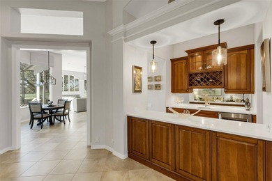 Schedule a private showing to tour this 4-bedroom, 4-bath pool on Laurel Oak Country Club in Florida - for sale on GolfHomes.com, golf home, golf lot