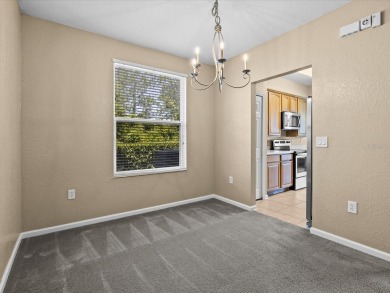 Enjoy Florida living in this delightful first-floor, end unit on ChampionsGate Golf Resort in Florida - for sale on GolfHomes.com, golf home, golf lot