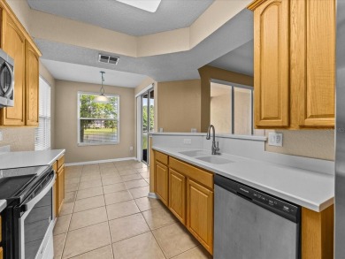 Enjoy Florida living in this delightful first-floor, end unit on ChampionsGate Golf Resort in Florida - for sale on GolfHomes.com, golf home, golf lot