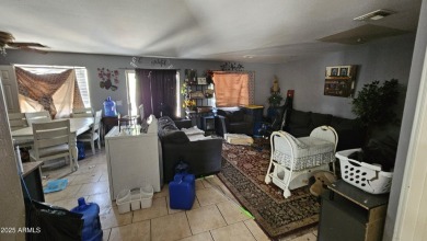 Investor special! Spacious 5-bedroom, 2.5-bath fixer-upper on Oasis Golf Club in Arizona - for sale on GolfHomes.com, golf home, golf lot