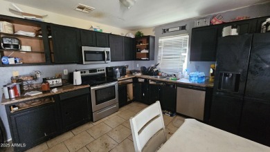 Investor special! Spacious 5-bedroom, 2.5-bath fixer-upper on Oasis Golf Club in Arizona - for sale on GolfHomes.com, golf home, golf lot