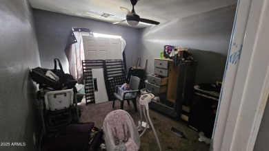 Investor special! Spacious 5-bedroom, 2.5-bath fixer-upper on Oasis Golf Club in Arizona - for sale on GolfHomes.com, golf home, golf lot