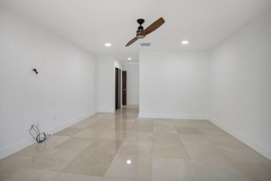 This remodeled two-story villa is a must-see. It's been on Boca Lago Golf and Country Club in Florida - for sale on GolfHomes.com, golf home, golf lot