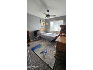 Investor special! Spacious 5-bedroom, 2.5-bath fixer-upper on Oasis Golf Club in Arizona - for sale on GolfHomes.com, golf home, golf lot