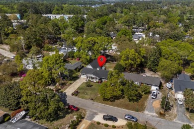This casa on Yucca Ave. is bursting with personality inside and on Pine Lakes Country Club in South Carolina - for sale on GolfHomes.com, golf home, golf lot