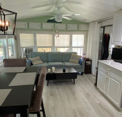 This beautiful park model home has been totally updated with new on Clerbrook Resort, Inc. in Florida - for sale on GolfHomes.com, golf home, golf lot