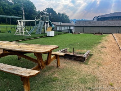 Come check out this spacious 3 bed, 2 bath lakefront condo at on Lake Valley Country Club in Missouri - for sale on GolfHomes.com, golf home, golf lot