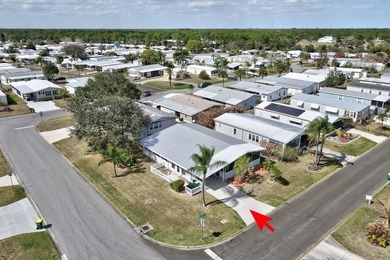 PRICE IMPROVEMENT: FLOWER Section/BAREFOOT BAY - CORNER LOT with on Barefoot Bay Golf Course in Florida - for sale on GolfHomes.com, golf home, golf lot