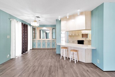 PRICE IMPROVEMENT: FLOWER Section/BAREFOOT BAY - CORNER LOT with on Barefoot Bay Golf Course in Florida - for sale on GolfHomes.com, golf home, golf lot