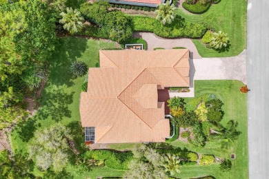 Nestled within the serene and exclusive Harbour Ridge Yacht & on Harbour Ridge Yacht and Country Club in Florida - for sale on GolfHomes.com, golf home, golf lot