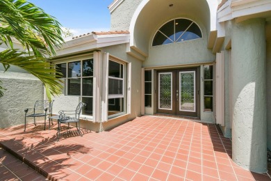 Nestled within the serene and exclusive Harbour Ridge Yacht & on Harbour Ridge Yacht and Country Club in Florida - for sale on GolfHomes.com, golf home, golf lot