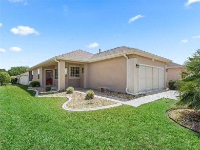 Welcome to your new home in a truly gated community! This on Eagle Ridge At Spruce Creek Country Club in Florida - for sale on GolfHomes.com, golf home, golf lot