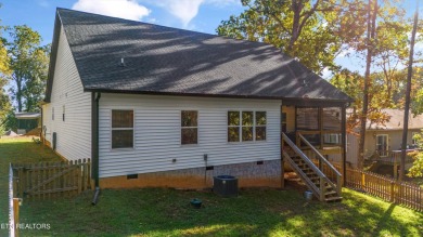 This stunning single-level home is full of modern touches and on Toqua Golf Course - Loudon County in Tennessee - for sale on GolfHomes.com, golf home, golf lot