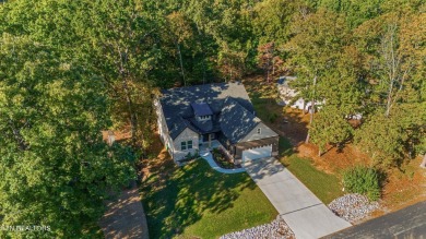 This stunning single-level home is full of modern touches and on Toqua Golf Course - Loudon County in Tennessee - for sale on GolfHomes.com, golf home, golf lot