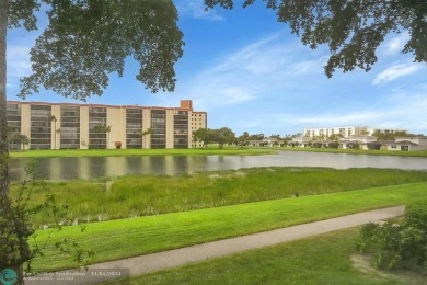 Desirable 2 bedroom, 2 bath unit in Deauville section of on Marina Lakes Golf Course in Florida - for sale on GolfHomes.com, golf home, golf lot