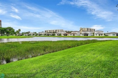 Desirable 2 bedroom, 2 bath unit in Deauville section of on Marina Lakes Golf Course in Florida - for sale on GolfHomes.com, golf home, golf lot