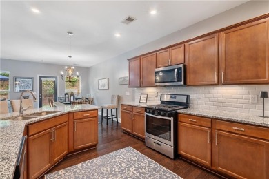 Welcome home to this meticulously maintained 4-bedroom, 2 on Woodmont Golf and Country Club in Georgia - for sale on GolfHomes.com, golf home, golf lot
