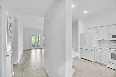 Enjoy the fabulous lifestyle of Grand Harbor! Rare 1st floor on Oak Harbor Country Club in Florida - for sale on GolfHomes.com, golf home, golf lot