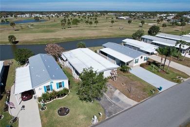 One of the best views in Barefoot Bay, overlooking both the golf on Barefoot Bay Golf Course in Florida - for sale on GolfHomes.com, golf home, golf lot