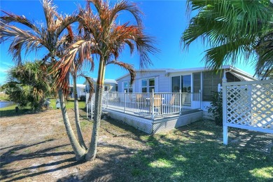 One of the best views in Barefoot Bay, overlooking both the golf on Barefoot Bay Golf Course in Florida - for sale on GolfHomes.com, golf home, golf lot