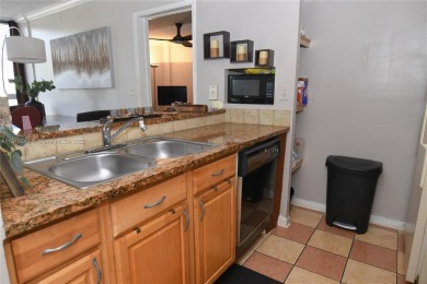 Charming 2-Bedroom Condo in Desirable Las Brisas at Country Club on Country Club of Miami in Florida - for sale on GolfHomes.com, golf home, golf lot
