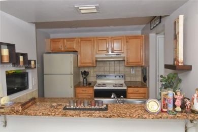 Charming 2-Bedroom Condo in Desirable Las Brisas at Country Club on Country Club of Miami in Florida - for sale on GolfHomes.com, golf home, golf lot