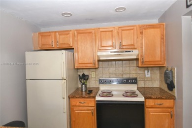 Charming 2-Bedroom Condo in Desirable Las Brisas at Country Club on Country Club of Miami in Florida - for sale on GolfHomes.com, golf home, golf lot