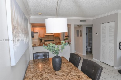 Charming 2-Bedroom Condo in Desirable Las Brisas at Country Club on Country Club of Miami in Florida - for sale on GolfHomes.com, golf home, golf lot