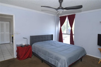 Charming 2-Bedroom Condo in Desirable Las Brisas at Country Club on Country Club of Miami in Florida - for sale on GolfHomes.com, golf home, golf lot