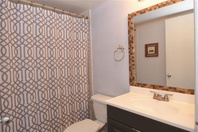 Charming 2-Bedroom Condo in Desirable Las Brisas at Country Club on Country Club of Miami in Florida - for sale on GolfHomes.com, golf home, golf lot