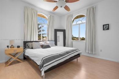 Step into a world of refined luxury and seclusion with on Weston Hills Country Club in Florida - for sale on GolfHomes.com, golf home, golf lot