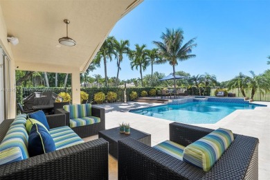 Step into a world of refined luxury and seclusion with on Weston Hills Country Club in Florida - for sale on GolfHomes.com, golf home, golf lot