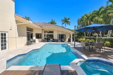 Step into a world of refined luxury and seclusion with on Weston Hills Country Club in Florida - for sale on GolfHomes.com, golf home, golf lot