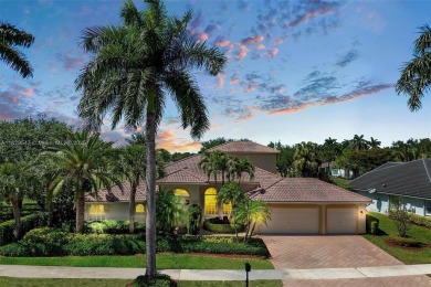 Step into a world of refined luxury and seclusion with on Weston Hills Country Club in Florida - for sale on GolfHomes.com, golf home, golf lot