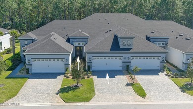 Don't miss this beautifully designed 3-bedroom, 3-bath townhome on Plantation Bay Golf and Country Club in Florida - for sale on GolfHomes.com, golf home, golf lot