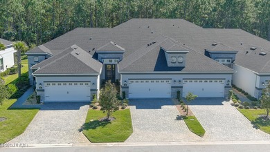 Don't miss this beautifully designed 3-bedroom, 3-bath townhome on Plantation Bay Golf and Country Club in Florida - for sale on GolfHomes.com, golf home, golf lot