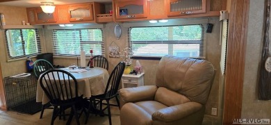 Beautifully maintained 2007 Forest River Cardinal 34' Fifth on River Ridge Golf Club in Virginia - for sale on GolfHomes.com, golf home, golf lot