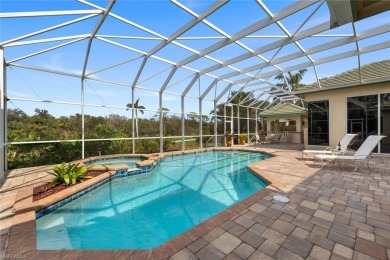 This fabulous Creekside home has it all!  An impressive circular on Bonita Bay West in Florida - for sale on GolfHomes.com, golf home, golf lot