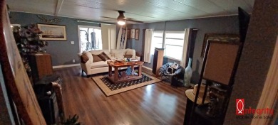 Come settle down and relax in a beautiful manufactured home with on Fairways Country Club in Florida - for sale on GolfHomes.com, golf home, golf lot